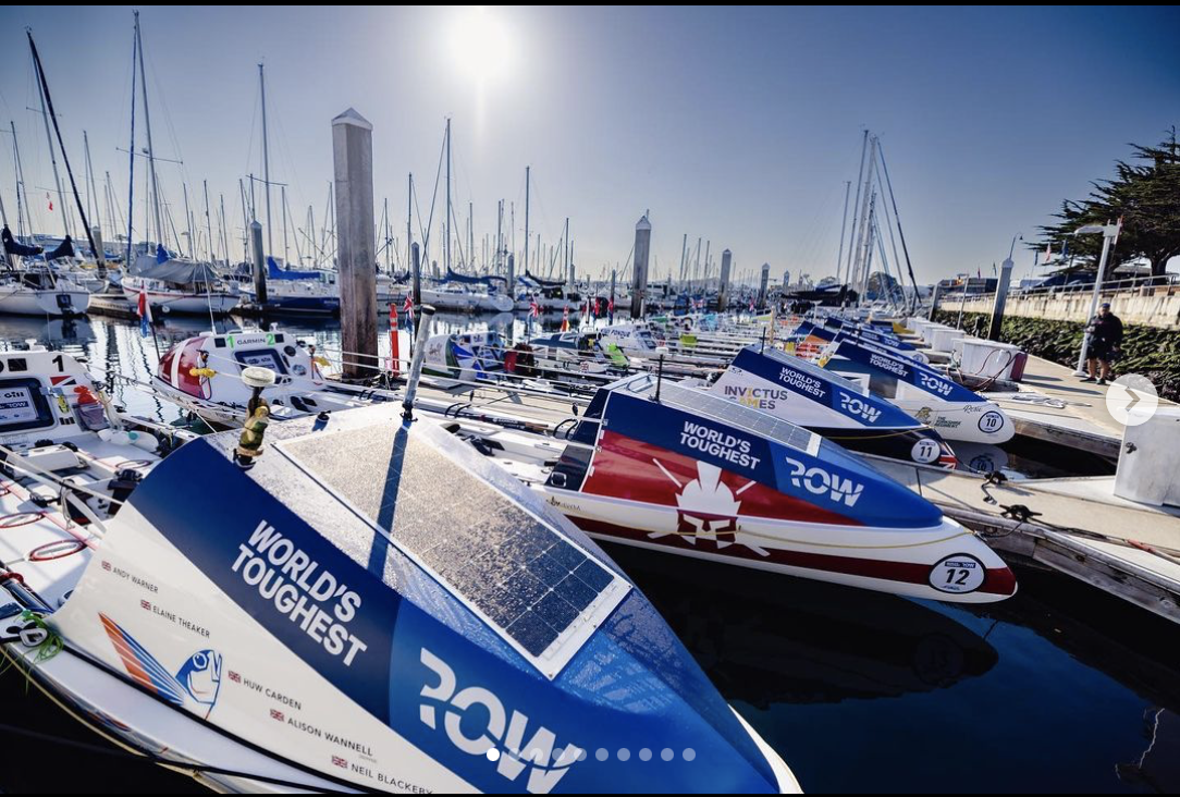 Boats floating in a harbor on a sunny day.